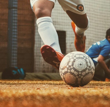 Football player competing for the ball in a match