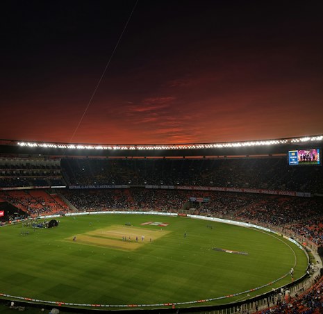 Cricket field under evening light for a T20 match